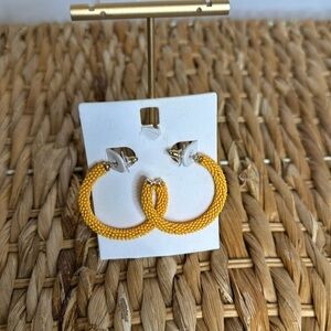 Hoop earrings 
orangish beads‎